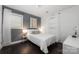 Serene bedroom with a comfortable bed, soft lighting, and modern decor at 2601 Dora Dr, Charlotte, NC 28215