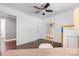 Bedroom showcasing dark wood floors and an easel displaying artwork at 2601 Dora Dr, Charlotte, NC 28215