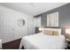Cozy bedroom with hardwood floors, comfortable queen bed, and ample natural light at 2601 Dora Dr, Charlotte, NC 28215