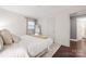 Bedroom featuring hardwood floors, a cozy bed, and an inviting atmosphere at 2601 Dora Dr, Charlotte, NC 28215