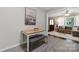 Dining area with table, bench seating and view into living room at 2601 Dora Dr, Charlotte, NC 28215