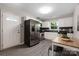 Modern kitchen with stainless steel appliances and white cabinets at 2601 Dora Dr, Charlotte, NC 28215