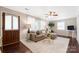 Cozy living room with hardwood floors, stylish seating, and ample natural light at 2601 Dora Dr, Charlotte, NC 28215