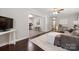 Bright living room showcases hardwood floors, a plush rug, and an open floor plan at 2601 Dora Dr, Charlotte, NC 28215