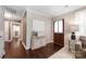 Entryway with hardwood floors, decorative console table, and a glimpse of the living room at 2601 Dora Dr, Charlotte, NC 28215