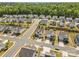 An aerial view of a suburban neighborhood featuring well-maintained homes and tree-lined streets at 2704 Watergarden St, York, SC 29745