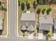 Overhead view showcasing a home with a gray roof, driveway, and well-kept lawn at 2704 Watergarden St, York, SC 29745