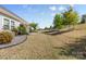 Expansive backyard featuring a gentle slope, lush greenery, and a small patio perfect for outdoor enjoyment at 2704 Watergarden St, York, SC 29745