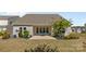 Spacious backyard with a covered patio, perfect for entertaining, surrounded by neat landscaping and lush greenery at 2704 Watergarden St, York, SC 29745