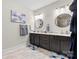 Contemporary bathroom with double vanity, modern lighting, and stylish mirrors, offering a luxurious feel at 2704 Watergarden St, York, SC 29745