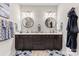 Bright bathroom featuring a dual sink vanity with marble countertop and round mirrors at 2704 Watergarden St, York, SC 29745