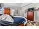 Comfortable bedroom featuring a spacious bed, wooden dresser, and a cozy rug, creating a relaxing retreat at 2704 Watergarden St, York, SC 29745