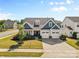 Charming two-story home with a well-maintained lawn, inviting curb appeal, and a two-car garage at 2704 Watergarden St, York, SC 29745