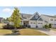 Charming two-story home featuring blue and gray siding, a two-car garage, and a well-manicured front yard at 2704 Watergarden St, York, SC 29745