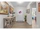 Welcoming foyer with stylish decor, including artwork, flowers, and a decorative console table at 2704 Watergarden St, York, SC 29745