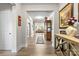 Inviting hallway with hardwood floors, decorative accents, and an open view into the living area at 2704 Watergarden St, York, SC 29745