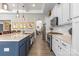 Modern kitchen with a large island, granite countertops, stainless steel appliances, and wood flooring at 2704 Watergarden St, York, SC 29745