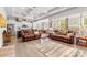 Open living space with coffered ceilings, wood flooring, and comfortable leather sofas, perfect for entertaining at 2704 Watergarden St, York, SC 29745