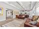 Spacious living room featuring coffered ceilings, wood floors, and comfortable leather furniture, perfect for relaxation at 2704 Watergarden St, York, SC 29745