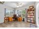 Bright home office with large windows, built-in bookcases, and ample desk space, ideal for productivity at 2704 Watergarden St, York, SC 29745