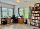 Home office with lots of natural light, wood floors, and built in bookshelves at 2704 Watergarden St, York, SC 29745
