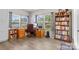 Spacious office with wood furniture, natural lighting, and a large bookshelf at 2704 Watergarden St, York, SC 29745