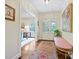 Bright foyer featuring hardwood floors, a decorative rug, and soft lighting at 301 Glen Oaks Rd, Charlotte, NC 28270