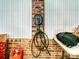 Close up of an EV charger installed on a brick wall inside a garage with white paneling at 301 Glen Oaks Rd, Charlotte, NC 28270