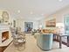 Bright living room with fireplace, neutral carpet, and stylish furnishings at 301 Glen Oaks Rd, Charlotte, NC 28270