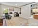 Spacious home office with custom built-ins, desk, and comfortable seating at 301 Glen Oaks Rd, Charlotte, NC 28270