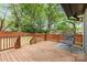 Relaxing backyard deck featuring wooden railings, a modern outdoor chair, and a fenced yard at 3256 Brixton Ct, Charlotte, NC 28205