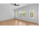 Bright bedroom featuring hardwood floors and ample natural light from the surrounding windows at 3256 Brixton Ct, Charlotte, NC 28205