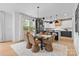 Dining room with modern light fixture and seating for six at 3256 Brixton Ct, Charlotte, NC 28205