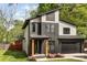 Modern two-story home with a black-and-white exterior and a well-maintained front yard at 3256 Brixton Ct, Charlotte, NC 28205