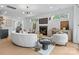 Cozy living room with a fireplace, hardwood floors, and views of the adjacent rooms at 3256 Brixton Ct, Charlotte, NC 28205