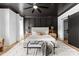The primary bedroom is complete with a black ceiling, and elegant decor creating a serene retreat at 3256 Brixton Ct, Charlotte, NC 28205