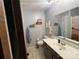 Bright bathroom with a vanity, toilet, mirror, and neutral decor at 33611 Mann Rd, Albemarle, NC 28001