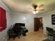 Bedroom with hardwood floors, ceiling fan, monitor, and neutral color walls at 33611 Mann Rd, Albemarle, NC 28001
