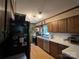 Traditional kitchen featuring wood cabinets, white tile backsplash, stainless steel appliances, and hardwood floors at 33611 Mann Rd, Albemarle, NC 28001