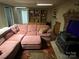 The living room offers a pink sofa and fireplace, creating a warm and inviting atmosphere at 33611 Mann Rd, Albemarle, NC 28001