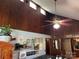 Bright living room with high ceilings, wood walls, a ceiling fan, and decor creates a cozy vibe at 33611 Mann Rd, Albemarle, NC 28001