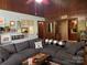Cozy living room with a large sectional sofa, wood accents, and natural light at 33611 Mann Rd, Albemarle, NC 28001