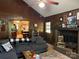 Comfortable living room featuring a brick fireplace and a view into the kitchen at 33611 Mann Rd, Albemarle, NC 28001