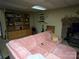 Comfortable living room has a pink sofa, fireplace, and built-in shelving for storage at 33611 Mann Rd, Albemarle, NC 28001