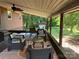Covered outdoor patio featuring comfortable seating and views of the surrounding greenery at 33611 Mann Rd, Albemarle, NC 28001