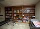 Basement area with full wall built-in bookshelves, providing ample storage for all of your belongings at 33611 Mann Rd, Albemarle, NC 28001