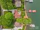 Stunning aerial view of lakefront home with lush landscaping and private boat dock at 376 Oak Tree Rd # 37, Mooresville, NC 28117