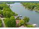 Aerial view of a lakeside home surrounded by lush greenery and lake access at 376 Oak Tree Rd # 37, Mooresville, NC 28117