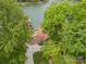 Aerial view of a lakeside home surrounded by lush greenery and lake access at 376 Oak Tree Rd # 37, Mooresville, NC 28117