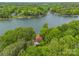 Aerial view of a lakeside home surrounded by lush greenery and lake access at 376 Oak Tree Rd # 37, Mooresville, NC 28117
